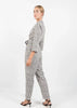 White Polka Dot Styled Jumpsuit with Belt and Lapels by Linu