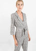 White Polka Dot Styled Jumpsuit with Belt and Lapels by Linu